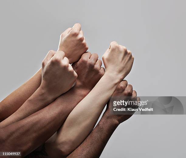 group 5 fists hold closely together - united ストックフォトと画像