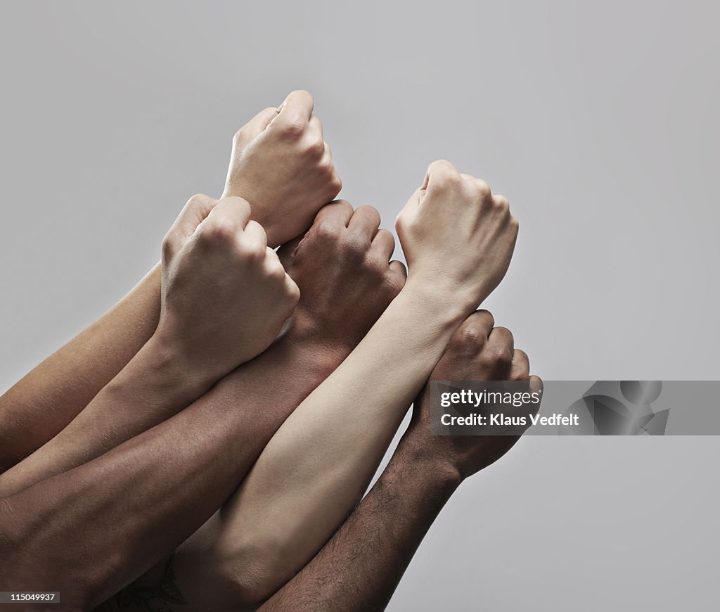 Group 5 fists hold closely together