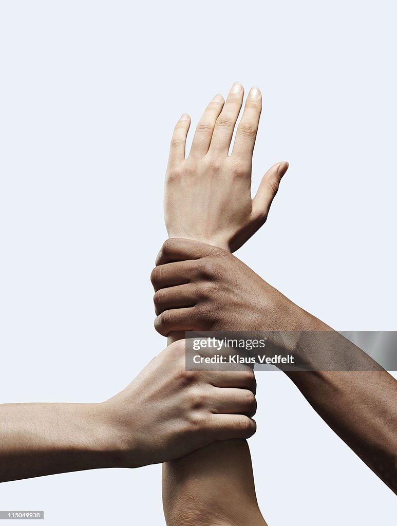 2 hands grabbing other open hand