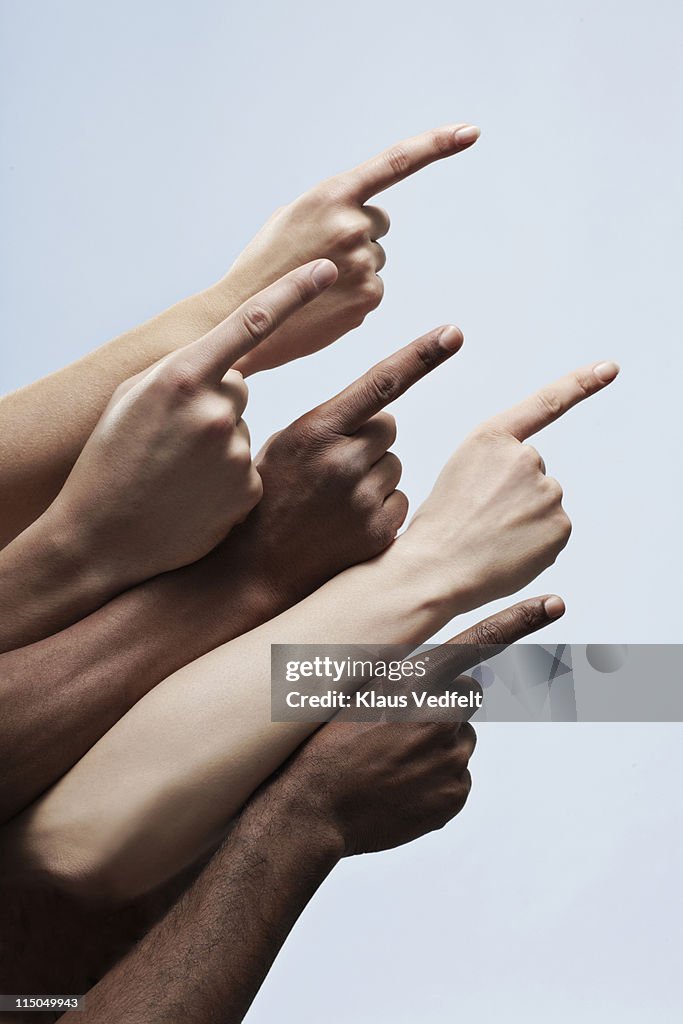 5 pointing fingers of multiple ethnicities