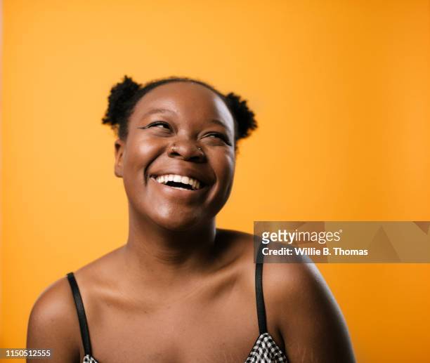black woman on colorful background - lady face black background happy stock-fotos und bilder