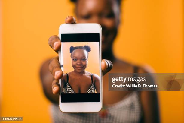 selfie of black woman on smartphone - generation z selfie stock pictures, royalty-free photos & images