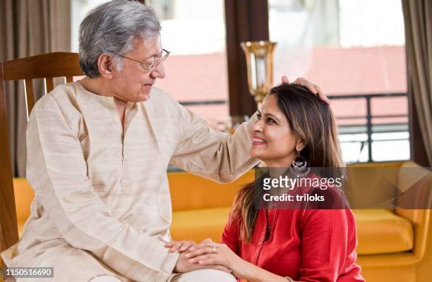 senior father with daughter at home - daughter stock pictures, royalty-free photos & images