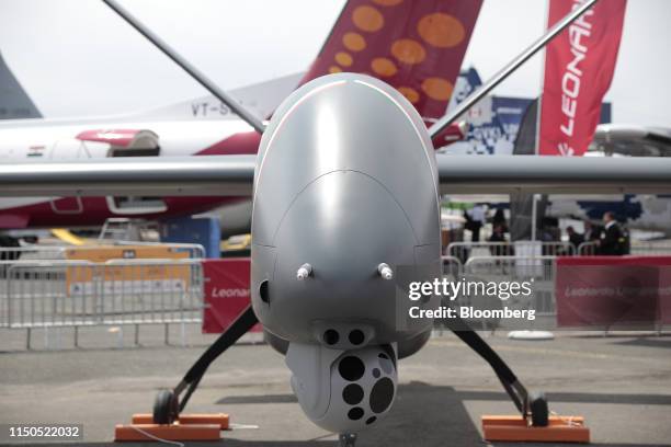 Multi-lens rotating camera sits under the nose of a Falco Xplorer autonomous drone, manufactured by Leonardo SpA, during the 53rd International Paris...