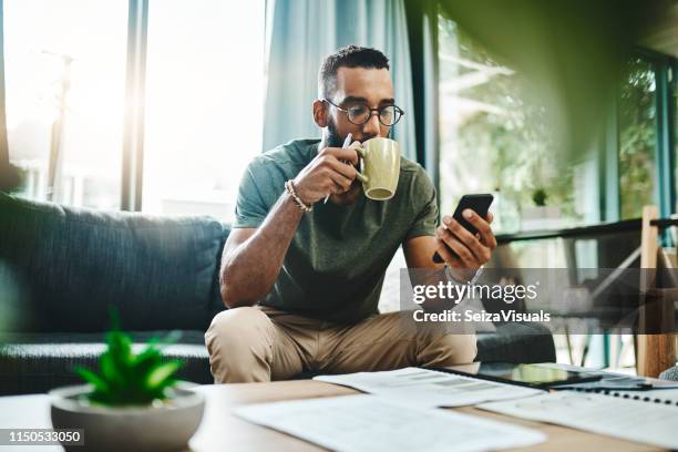 smart apps make for smarter financial planning - man at home stock pictures, royalty-free photos & images