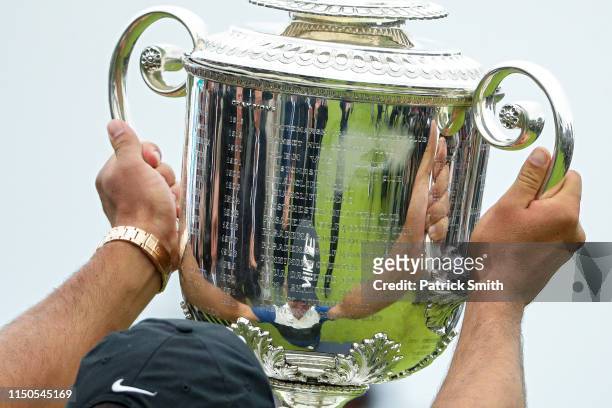 Brooks Koepka of the United States celebrates with the Wanamaker Trophy during the Trophy Presentation Ceremony after winning the final round of the...