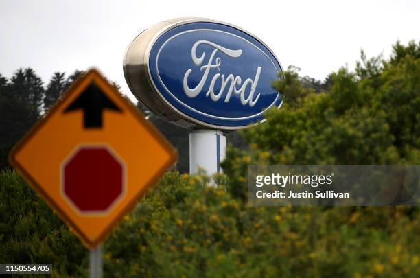Sign with the Ford logo is posted in front of Serramonte Ford on May 20, 2019 in Colma, California. Ford Motor Company announced plans to lay off...