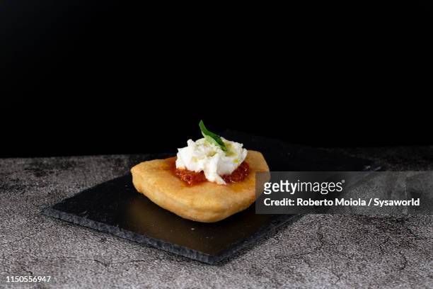 pizza margherita fritta (fried), italy - cutting board stock pictures, royalty-free photos & images