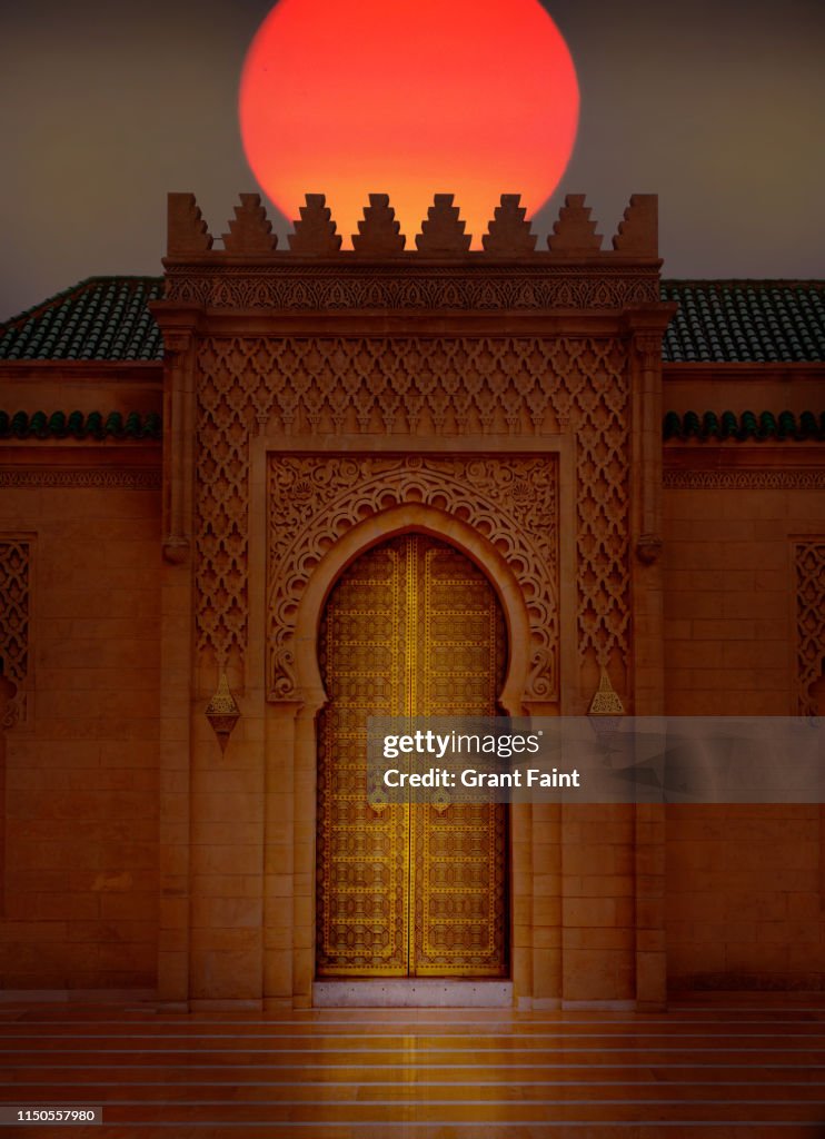 Sunset near doorway to mausoleum.