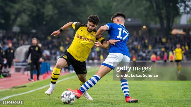 Reda Khadra of Dortmund challenges for the ball with Mehmet Can Aydin of Schalke during Borussia Dortmund U 19 v FC Schalke 04 U19 A-Juniors German...