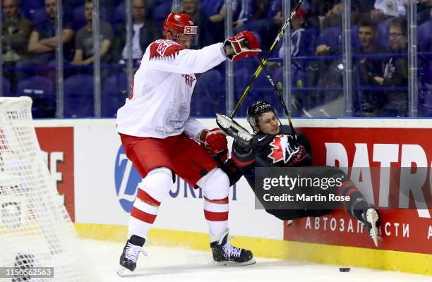 Anthony Cirelli of Canada challengesOliver Lauridsen of Denmark during the 2019 IIHF Ice Hockey World Championship Slovakia group A game between...