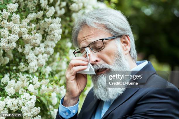 senior man suffering from allergy - spring allergies stock pictures, royalty-free photos & images