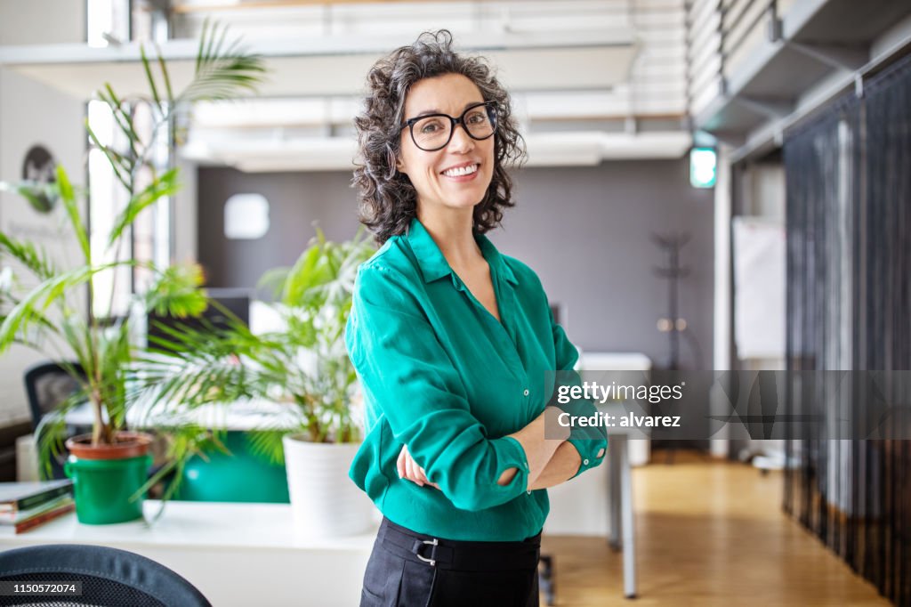 Portrait of confident mature businesswoman in office