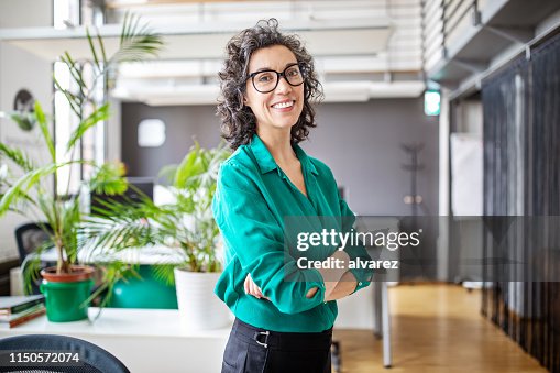 Portrait of confident mature businesswoman in office Portrait of confident mature businesswoman in office