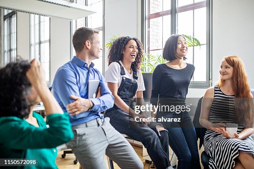 Professionals laughing in a meeting Professionals laughing in a meeting