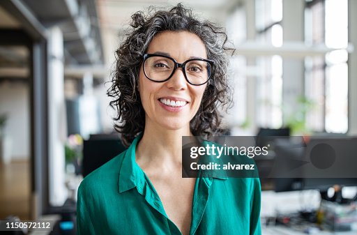 Close-up of a smiling mid adult businesswoman Close-up of a smiling mid adult businesswoman
