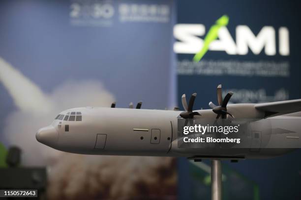 Model C130 military transport aircraft, manufactured by Lockheed Martin Corp., sits on the Saudi Arabian Military Industries Co. Exhibition stand...