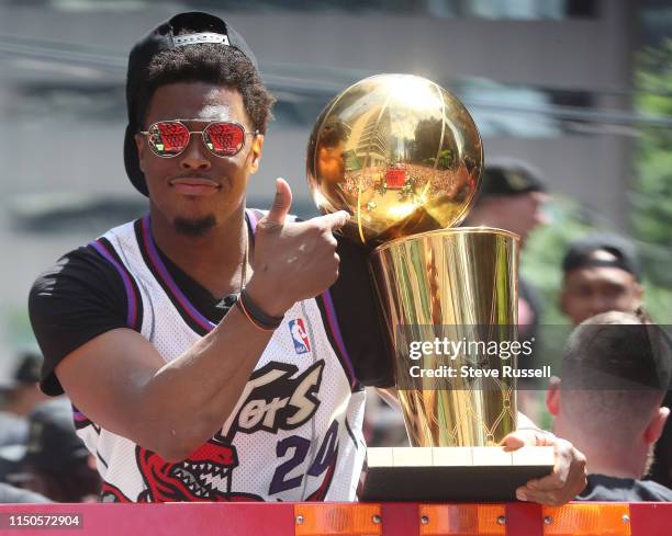 Kyle Lowry with the Larry O'Brien NBA Championship Trophy as the Toronto Raptors hold their victory parade after beating the Golden State Warriors in...
