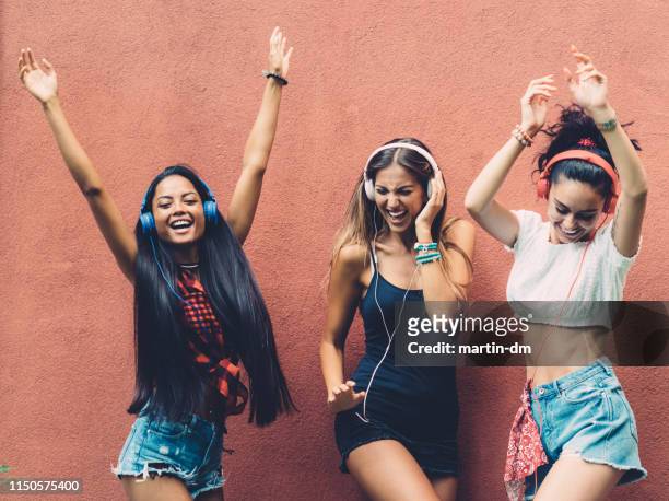 girls dancing to music - bulgaria dance stock pictures, royalty-free photos & images