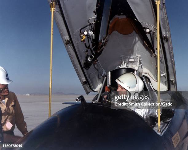 Astronaut Neil Armstrong in the cockpit of the X-15 Research Rocket aircraft after a research flight, 1961. Image courtesy National Aeronautics and...
