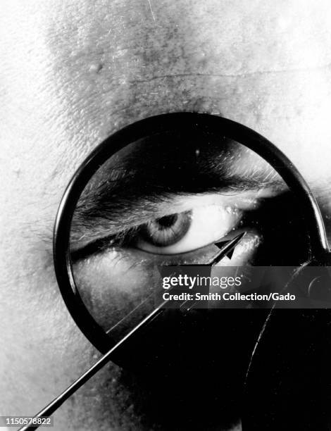 Engineer examines the one-inch scale model of a typical supersonic airplane at Langley Research Center, Hampton, Virginia, 1960. Image courtesy...