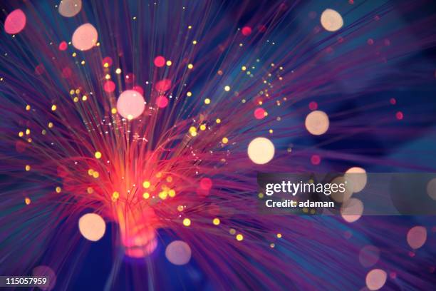 magic lights - fiber optic stock pictures, royalty-free photos & images