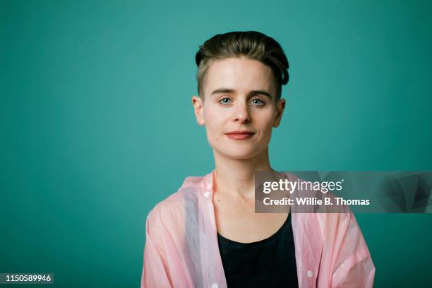 portrait of androgynous"nwoman - gay person color background stock pictures, royalty-free photos & images