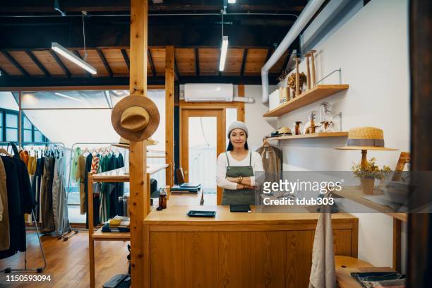 female small business owner ready to accept mobile payment via digital tablet - weekend activities stock pictures, royalty-free photos & images