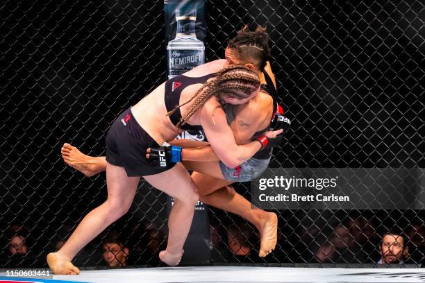 Aspen Ladd performs a takedown against Sijara Eubanks during round two of a bantamweight bout at Blue Cross Arena on May 18, 2019 in Rochester, New...