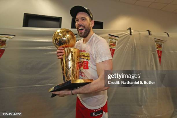 Marc Gasol of the Toronto Raptors holds the Larry O'Brien Championship Trophy in the locker room after defeating the Golden State Warriors in Game...