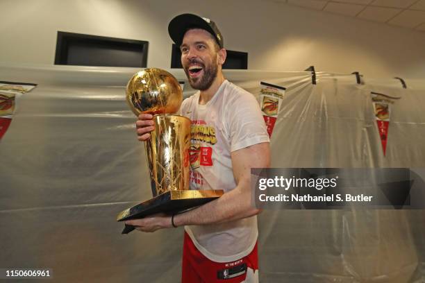 Marc Gasol of the Toronto Raptors holds the Larry O'Brien Championship Trophy in the locker room after defeating the Golden State Warriors in Game...