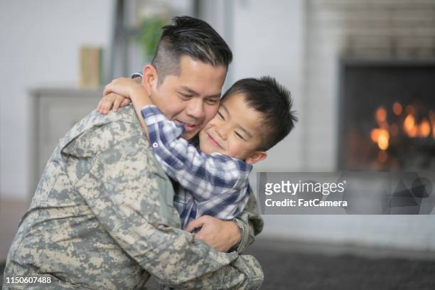 welcoming dad home - filipino family reunion stock pictures, royalty-free photos & images