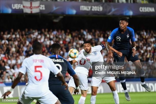 England's Jake Clarke-Salter and France's midfielder Jeff Reine-Adelaide go for the ball during the Group C match of the U21 European Football...