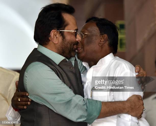 Minister of Minority Affairs Mukhtar Abbas Naqvi greets Pondicherry chief minister V. Narayanasamy on the second day of the first session of the 17th...