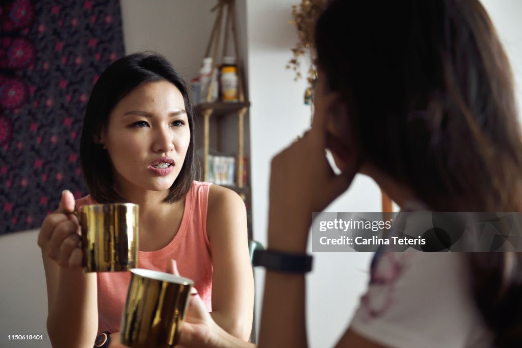 Roommates chatting in the dining room in the morning