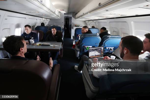 The Utah Jazz head coaching staff go over game details on the charter plane on the flight to go play the New Orleans Pelicans on March 05, 2019 in...