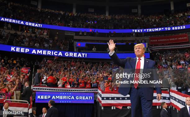 President Donald Trump arrives to speak during a rally at the Amway Center in Orlando, Florida to officially launch his 2020 campaign on June 18,...