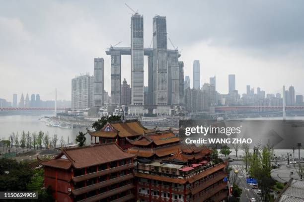 This picture taken on March 24, 2019 shows the Raffles City Chongqing under construction in southwest China's Chongqing Municipality. In many Chinese...