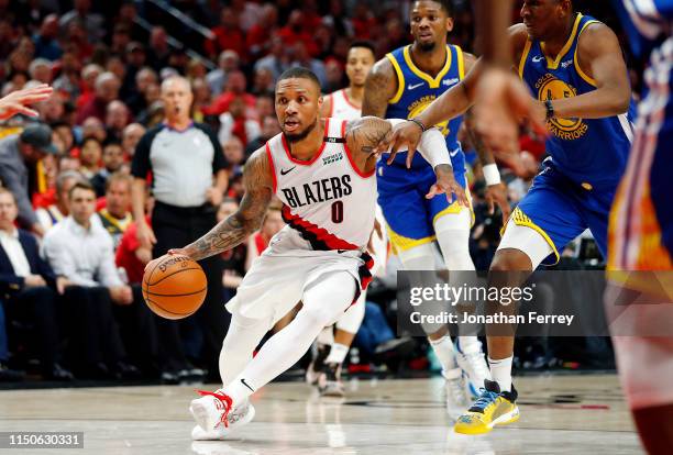 Damian Lillard of the Portland Trail Blazers handles the ball during the second half against the Golden State Warriors in game four of the NBA...