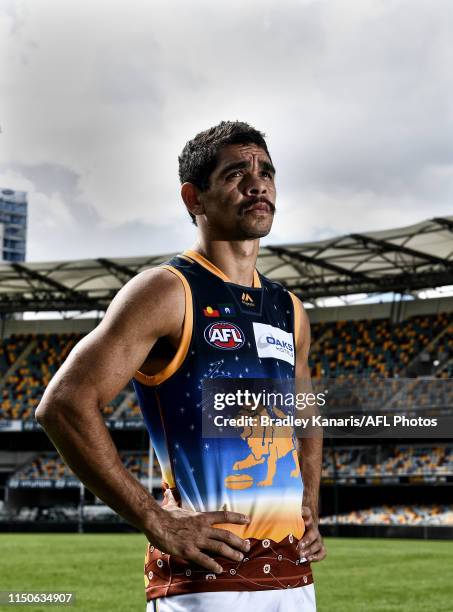 Charlie Cameron poses for a photo in an indigenous design guernsey during a Brisbane Lions AFL training session at the Gabba on May 21, 2019 in...