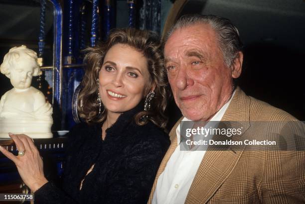 Faye Dunaway and Charles Bukowski pose for a portrait November 1987 in Los Angeles, California.