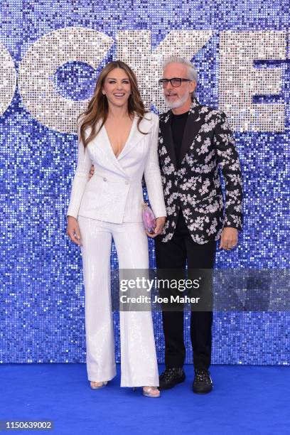 Elizabeth Hurley and Patrick Cox attend the "Rocketman" UK Premiere at Odeon Leicester Square on May 20, 2019 in London, United Kingdom.