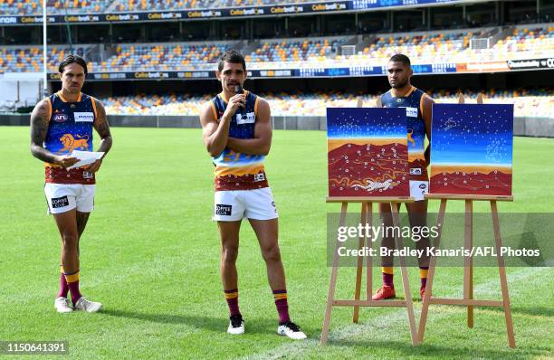 Charlie Cameron is seen wearing an indigenous designed guernsey as he speaks during a Brisbane Lions AFL Media Opportunity at the Gabba on May 21,...