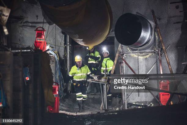 In this handout provided by the Stand With Pike Families Reference Group, workers reopen the entrance to the Pike River Mine on May 21, 2019 in...