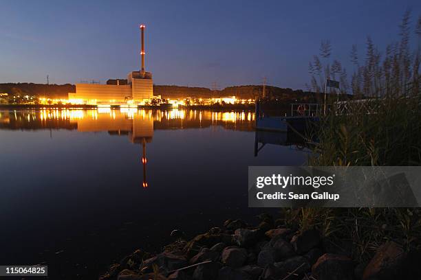 The troubled Kruemmel nuclear power plant stands illuminated on the Elbe River on June 2, 2011 in Geesthacht, Germany. The German government recently...