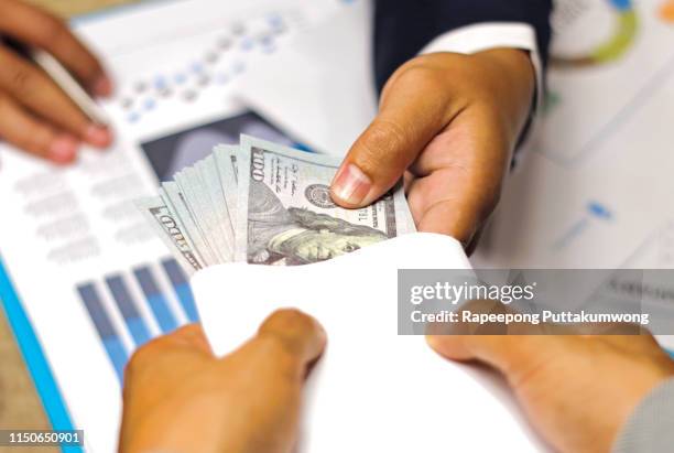 businessman receive money to agreement contract, anti bribery and corruption concept - anti graft stock pictures, royalty-free photos & images