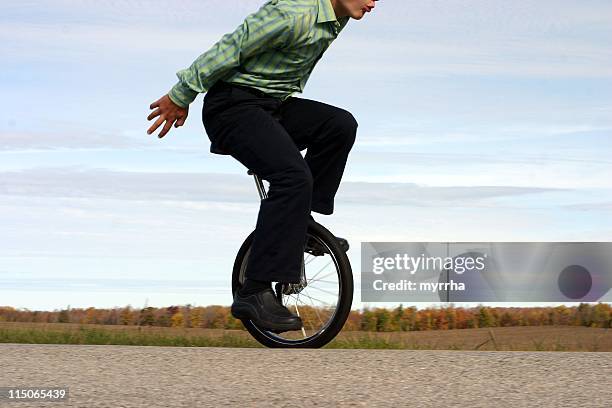 business unicycle balance - unicycle stock pictures, royalty-free photos & images