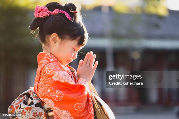 portrait of japanese girl wearing kimono - children praying stock pictures, royalty-free photos & images