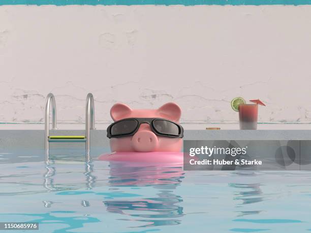 piggy bank on holiday - water cooler stock-fotos und bilder