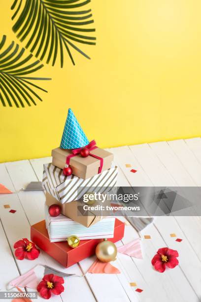 summer christmas day conceptual still life. - pile of gifts stock pictures, royalty-free photos & images